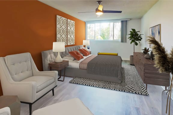 a bedroom with an orange accent wall and a bed at Casa Granada, Los Angeles, California