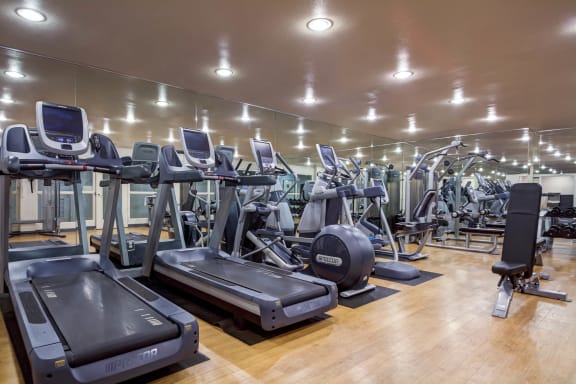 a gym with rows of treadmills and other exercise equipment at L'Estancia, Studio City, CA