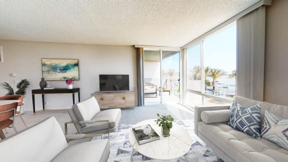 a living room with a couch and a table and a large window  at Marina Harbor, Marina del Rey, CA, 90292