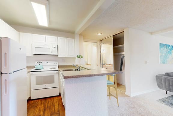 a kitchen with an island and a stove and a refrigerator at Mariners Village, Marina del Rey, 90292