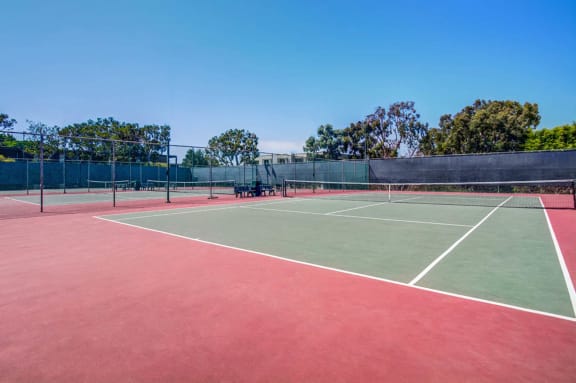 a tennis court with two chairs on it at Mariners Village, Marina del Rey, 90292