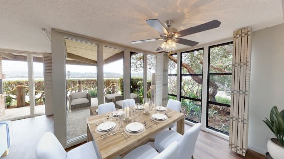 a dining room with a table and chairs and a ceiling fan at Mariners Village, Marina del Rey, 90292