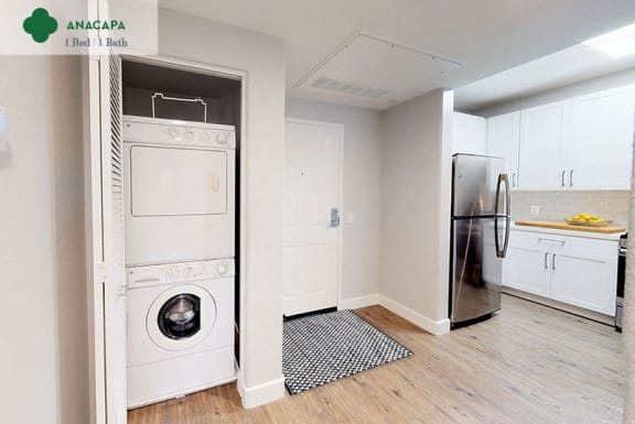 a white kitchen with a washing machine and a refrigerator  at Mission Hills, California, 93012