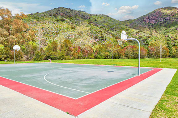 a basketball court in a park with mountains in the background at Mission Hills, Camarillo, CA