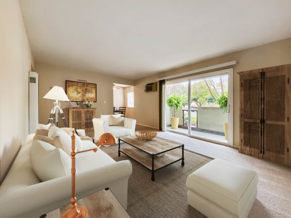 a living room with white furniture and a sliding glass door  at Pleasanton Place, Pleasanton, CA, 94566