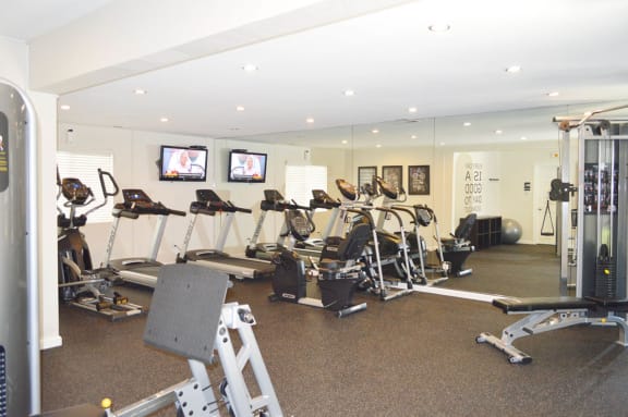 the gym is equipped with a variety of weights and cardio equipment at Pleasanton Glen Apartments, Pleasanton, 94566