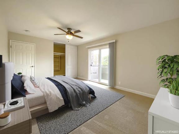 a bedroom with a bed and a ceiling fan at Pleasanton Heights, Pleasanton, CA
