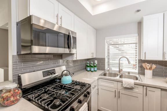 a kitchen with a stove and a sink