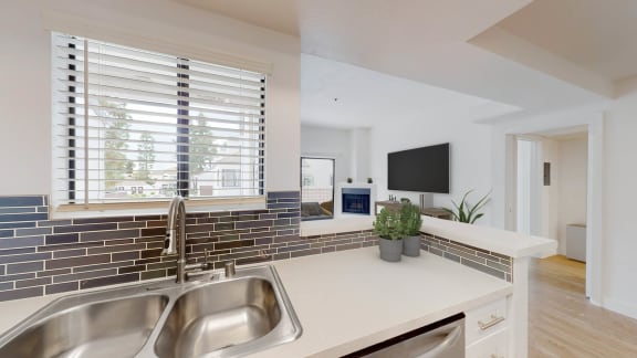a kitchen with a sink and a window at Sendero Huntington Beach, Huntington Beach California