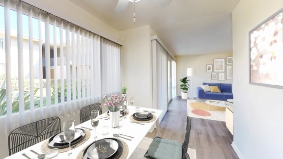 a dining room and living room with a table and chairs at West Park Village, California