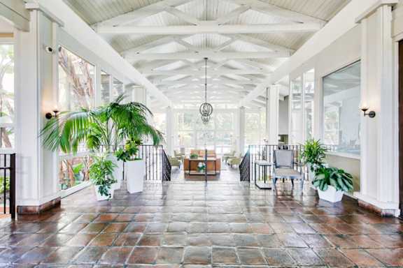 A large open room with a tiled floor and a white ceiling.