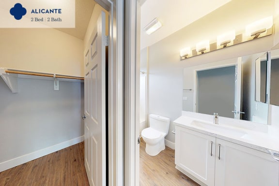 a bathroom with a toilet and a sink and a mirror at Mission Hills, Camarillo, California