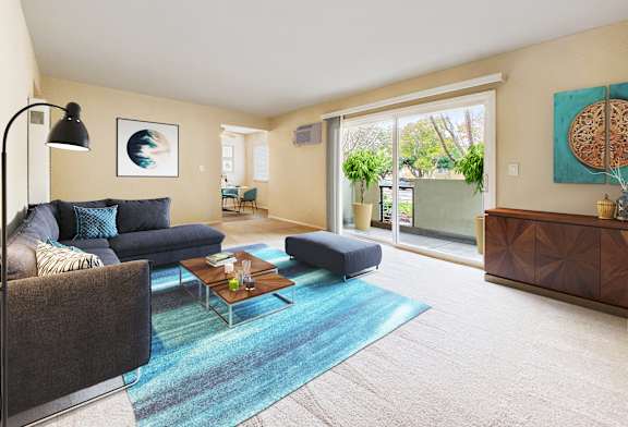 A living room with a blue rug and a grey couch at Pleasanton Place, Pleasanton, CA, 94566