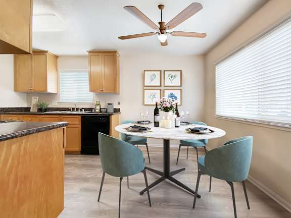 A kitchen with a table set for two and a ceiling fan at Pleasanton Place, Pleasanton, CA, 94566
