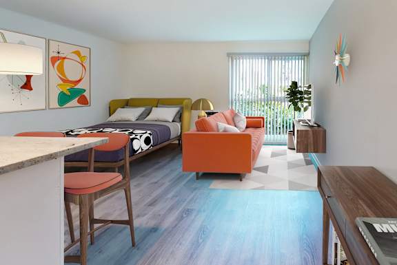 A bedroom with a bed, a couch, a chair, and a table.