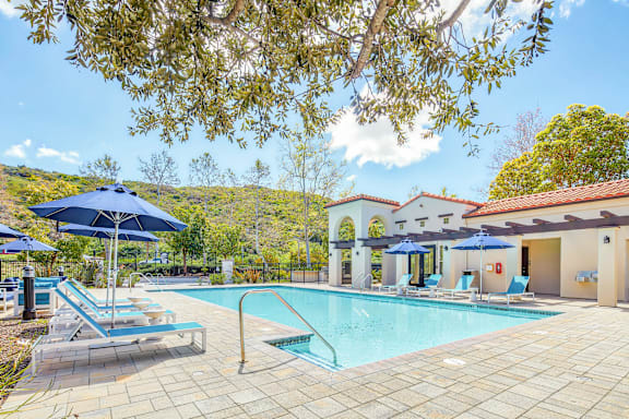 a swimming pool in front of a hotel with a pool at The Villas at Anacapa Canyon, Camarillo, California