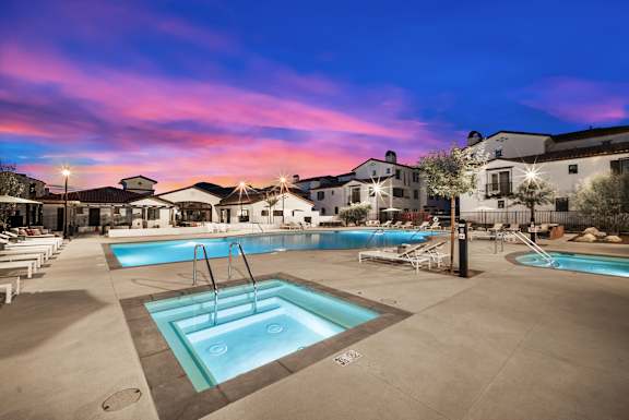 A large outdoor swimming pool with a fountain in the middle at The Villas at Anacapa Canyon, Camarillo