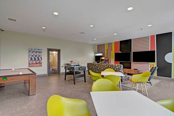 A modern living room with a variety of seating options.