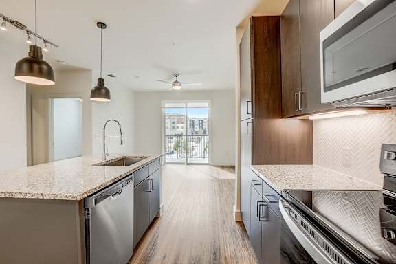 A modern kitchen with a view of the city.