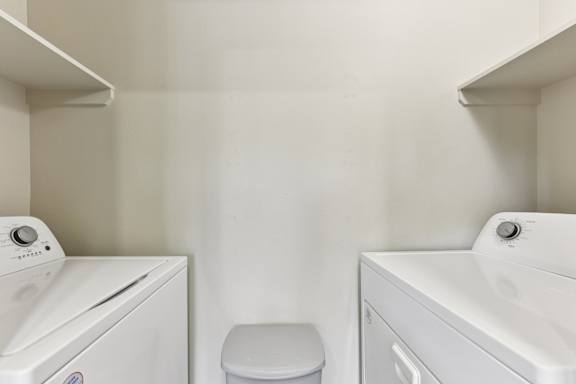 White washing machine at Waters Edge Apartment Homes, Texas