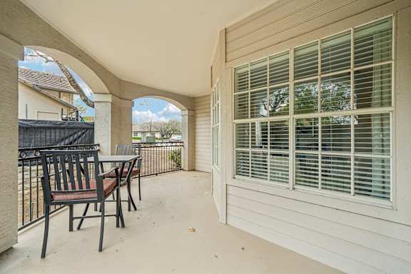 A patio with a table and chairs is shown.