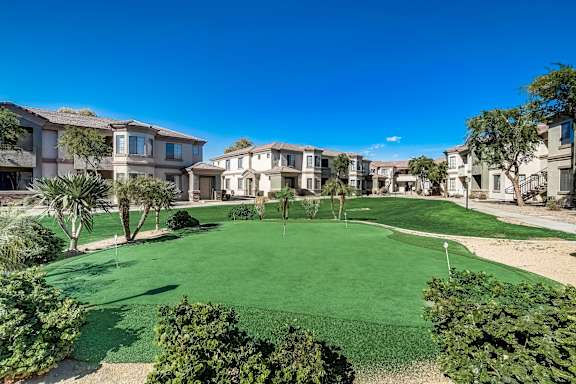 a putting green in the middle of an apartment complex  at Adiamo Palm Valley, Goodyear, AZ, 85395