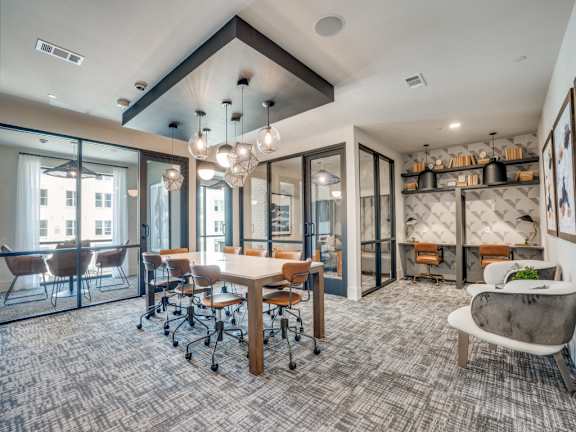 a conference room with a table and chairs and glass doors at Aurora Watson Branch, Mansfield, Texas