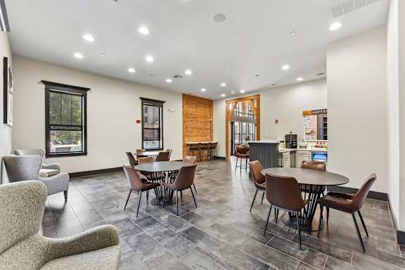 A room with a table and chairs in it.