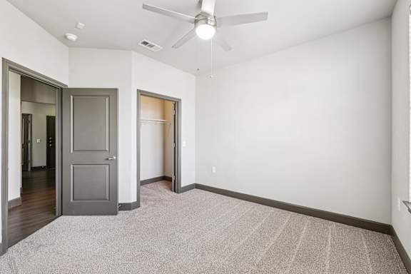 A room with a ceiling fan and a rug on the floor. at North Creek, Texas, 78634