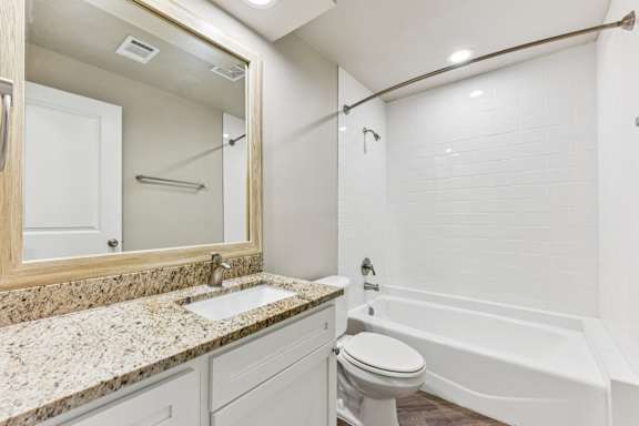 Bath and shower room at Waters Edge Apartment Homes, Texas