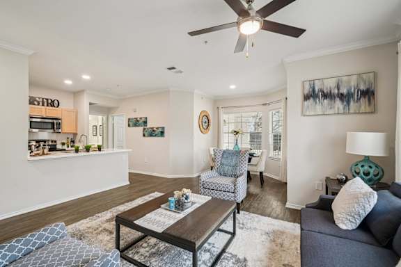 A living room with a grey couch and a coffee table.