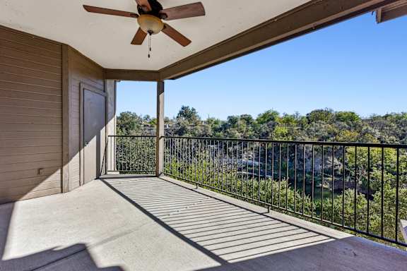 Balcony with a view of trees at Waters Edge Apartment Homes, Texas, 78626