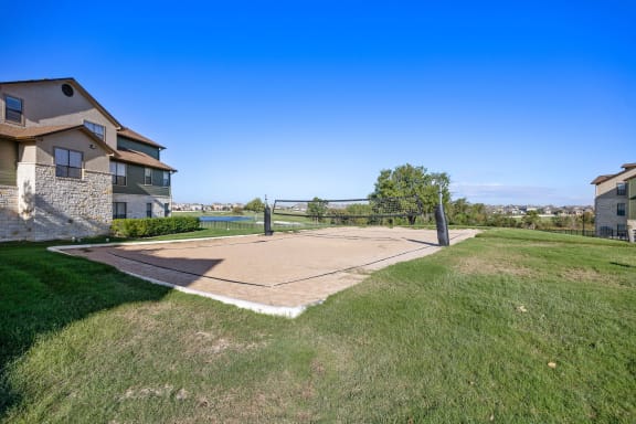 a basketball court in front of a house at The Fairways at Star Ranch, Hutto