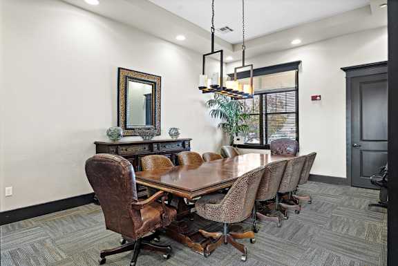a conference room with a large table and chairs at Las Brisas Apartment Homes, Texas
