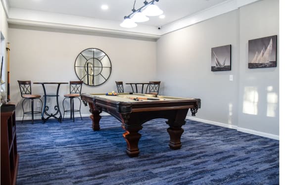 a game room with a pool table and chairs at The Legends at Eagle Mountain Lake, Fort Worth, TX, 76179
