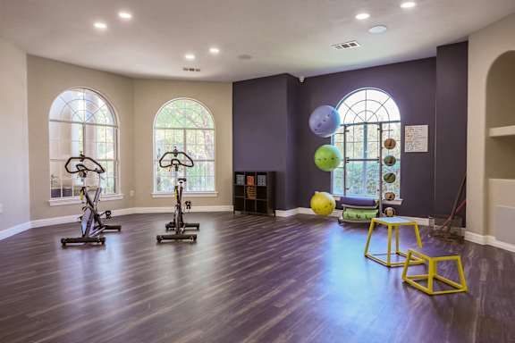 Interior of gym a large room with exercise equipment and balloons in a room with windows