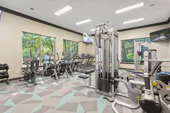 the apartments at masse corner 205 fitness room at Sonterra Apartment Homes, Austin