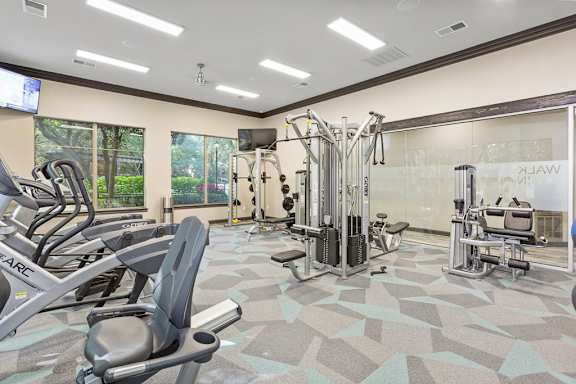the estates at tanglewood| fitness center with exercise equipment at Sonterra Apartment Homes, Austin, TX, 78726