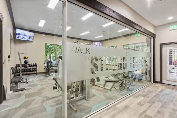 a view of the fitness center from the inside of the building at Sonterra Apartment Homes, Austin, TX