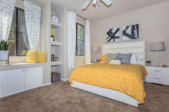 a bedroom with a yellow bed and a yellow blanket at The Preserve by Picerne, Nevada