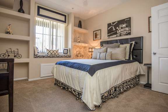 a bedroom with a bed and a window at The Passage by Picerne, Henderson, NV