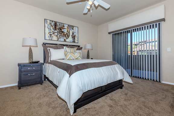 a bedroom with a bed and a ceiling fan at The Preserve by Picerne, Nevada, 89086