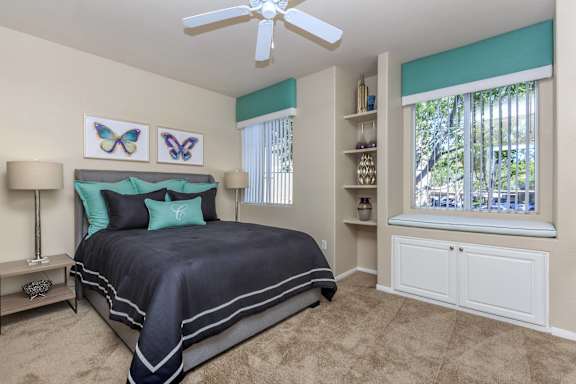 a bedroom with a bed and a ceiling fan at The Covington by Picerne, Las Vegas, NV, 89139