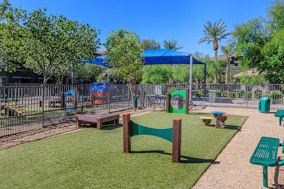 Playground with a picnic table and benches at The Presidio by Picerne, N Las Vegas, NV, Nevada