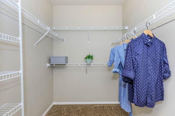 Walk in closet with racks at The Presidio by Picerne, N Las Vegas