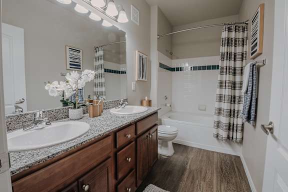 Bathroom with Shower Curtains at The Summit by Picerne Apartments, Henderson, NV, 89052