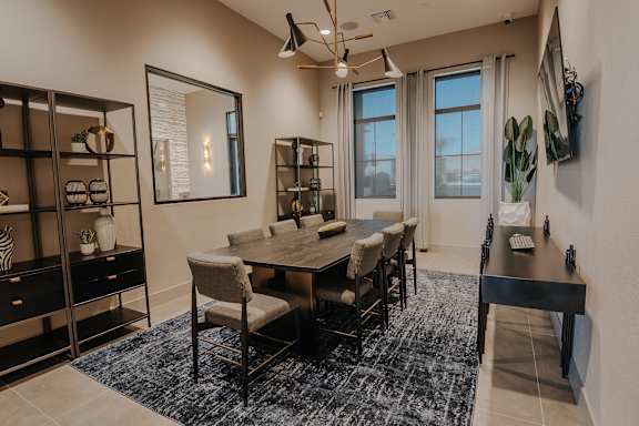 Conference room with table and TV for projection at Level 25 at The Curve by Picerne, Las Vegas, 89148