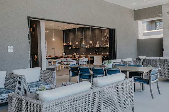 Indoor/outdoor patio to clubhouse with lots of seating at Level 25 at The Curve by Picerne, Las Vegas, NV, Nevada