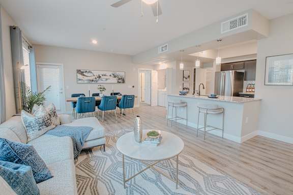 Living Room With Oversized Windows And Doors at Level 25 at The Curve by Picerne, Nevada