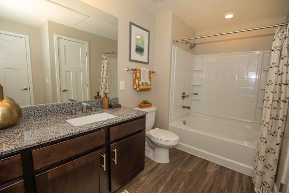 a bathroom with a sink toilet and shower at Level 25 at Cactus by Picerne Apartments, Las Vegas, NV